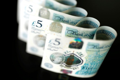 British five pound banknotes are seen in this picture illustration taken November 14, 2017