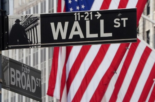 FILE PHOTO: The Wall Street sign is pictured at the New York Stock exchange (NYSE) in the Manhattan borough of New York City, New York, U.S., March 9, 2020. REUTERS/Carlo Allegri