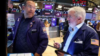 Wall Street closes down as investors brace for Powell's speech