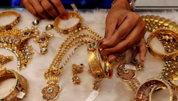 Gold Hits Record High on Trade War Woes, Weak Dollar