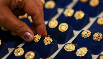 Gold Retreats from near 4-wk High as Dollar Gains; Investors Stay Cautious