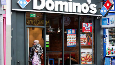 Domino's Keeps Sales View, Value-Seeking Diners Slow Growth