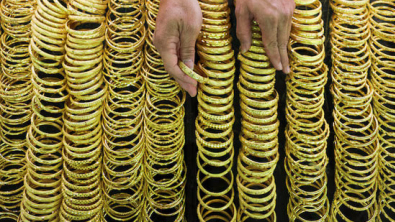 Gold Gains over 1% as USD, Yields Ease; Spotlight on Trade