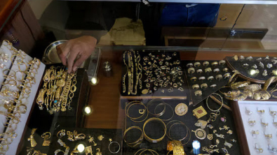 Gold Hits over 1-Week Low as Firmer US Dollar, Yields Weigh