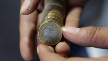 Rupee Hovers near Record Low as Central Bank Holds the Line