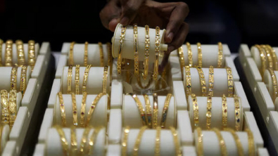 Gold Firms on Softer Dollar, Middle East Tensions