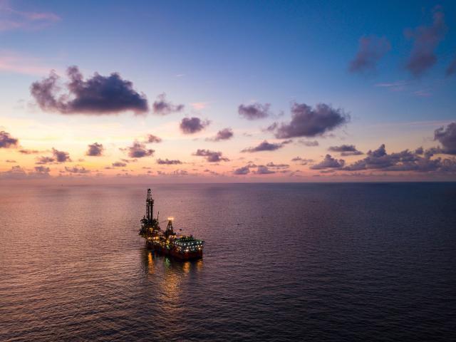 Oil rising as OPEC supply cuts kick in