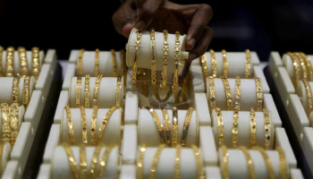 Gold Eases on Strong Dollar, Oil; US Inflation Data Eyed